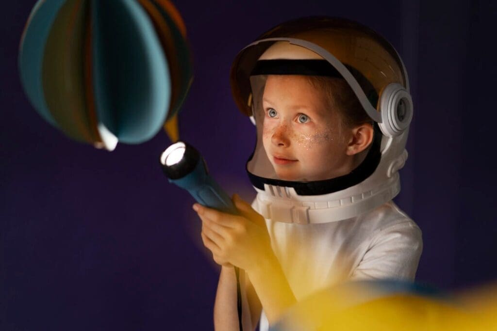 smiley kid holding flashlight side view space exploration